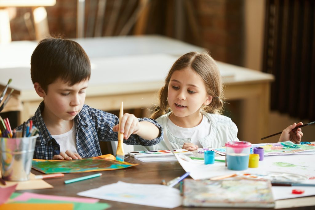 two kids painting