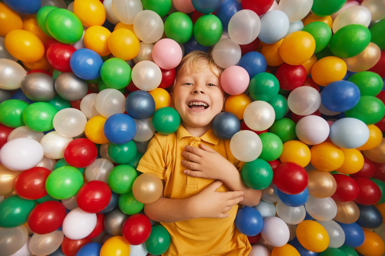 A happy young child staying focused and engaged during a learning game, supported by ADHD behavioral therapy in Miami
